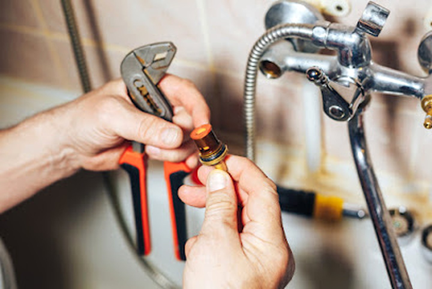 Plumbing repair work on a faucet fixture